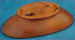 Underside of carved yew long bowl