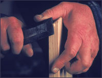 Woodworking craftsman paring with a chisel